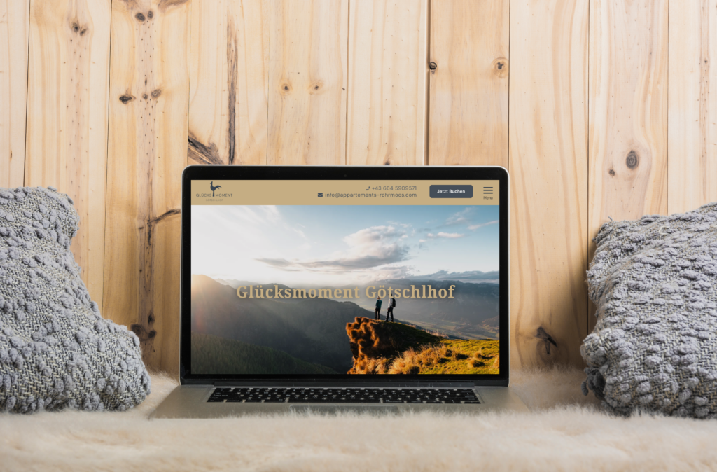 laptop pillow soft fur against wooden background 1